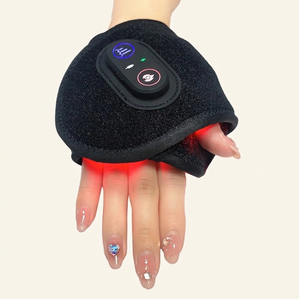 Black red light therapy wrist wrap worn on hand with illuminated red LEDs and control panel